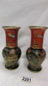 A pair of Carlton Ware black and terracotta New Mikdu Chinioserie vases.
