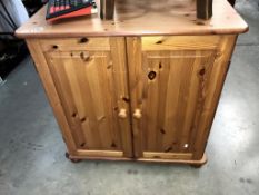 A pine 2 door computer desk/cupboard