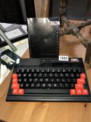 An Oric Atmos 48k computer and manual (no leads, untested,