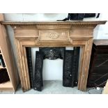 A cast iron fire place with pine surround (shelf 147 x 18cm) (collect only) ****Condition