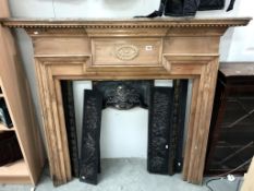 A cast iron fire place with pine surround (shelf 147 x 18cm) (collect only) ****Condition