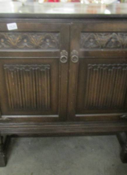 An oak two door cupboard. (Collect only).