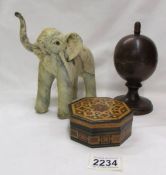 A Tunbridge style box, a globe shaped box with interior globe and an elephant.