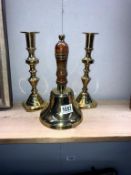 A pair of brass candlesticks and a brass bell