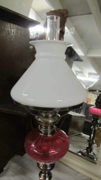 A telescopic 'candlestick' oil lamp with cranberry glass font. (collect only). - Image 3 of 3