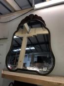 A late Victorian wall mirror in the aesthetic form with leaf carving