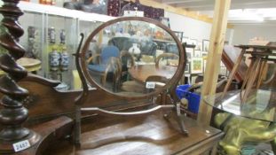 An oval mahogany toilet mirror. (Collect only).