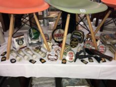 A good selection of pub/breweriana, pump lights, handles,