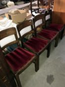 A set of 4 dark oak dining chairs