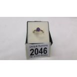 A 9ct gold ring set amethyst coloured stone, size P.