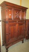 A Victorian dark oak cupboard with two drawers and two doors. (Collect only).