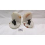 A pair of art deco spelter scottie dog marble book ends.