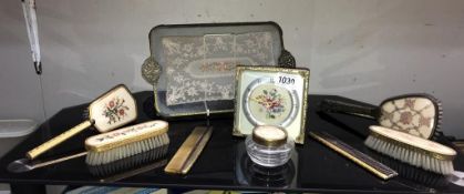 A vintage dressing table set with matching clock