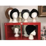 A good selection of Russian type hats and other hats (heads not included)