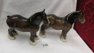 Two Beswick Shire horses.