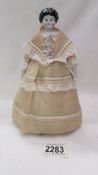 A Victorian glazed porcelain doll.