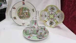 A Child's food warming plate, a fine porcelain bird decorated dish and a miniature tea set on tray.