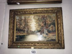 An oil on board of woodland pond 19th/20th century, signature indistinct, (frame 38.5cm x 28.
