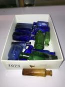 A selection of small blue & green poison bottles