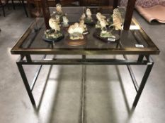 A large brass framed coffee table with smoke glass top (chip to 1 corner)(77cm x 77cm x 49cm)