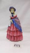 A Royal Doulton figurine, 'Victorian Lady' HN728. (hairline crack to base).