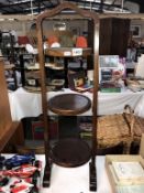 A dark wood stained 3 level cake stand