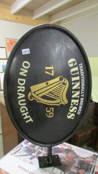 A double sided light up Guinness sign. (Collect only).