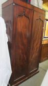 A mahogany two door wardrobe. (Collect only).