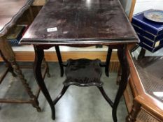 An Edwardian mahogany occasional table.