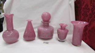 Five pieces of Mdina pink glass being four vases and a scent bottle.