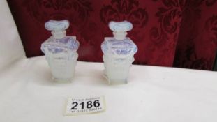A pair of Sabino, made in France opalescent perfume bottles.