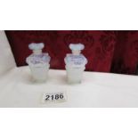 A pair of Sabino, made in France opalescent perfume bottles.