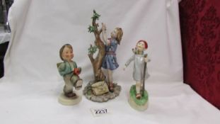 A Royal Worcester figure 'Thursday's Child', a Goebel boy and a figure of a girl.