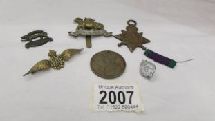 A small lot of badges including RAF wings, Queens etc.