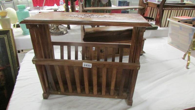 A mahogany magazine rack with brass inlay. (Collect only).