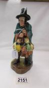 A Royal Doulton figurine, 'The Mask Seller', HN2103.
