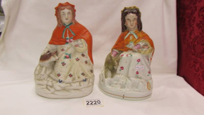 Two 19th century Staffordshire figures, one glazed, one unglazed, different colourways.