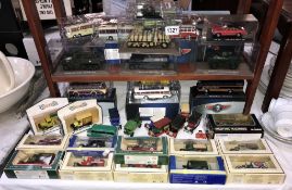 A quantity of diecast Lledo Atlas Classic coaches and military vehicles