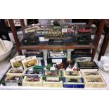 A quantity of diecast Lledo Atlas Classic coaches and military vehicles