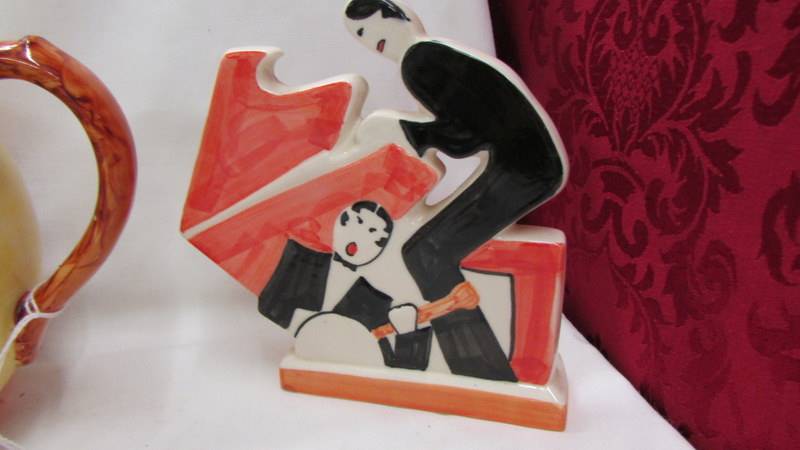 An abstract design tea set, two 1920's style figures and a Butler toast rack. - Image 3 of 5