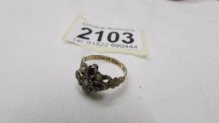 A 9ct gold ring set amethyst coloured stones and seed pearls. size M.