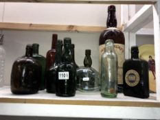 A quantity of mostly whiskey bottles including large Mackinlays brown bottle