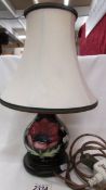 A Moorcroft table lamp with shade.