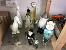 A collection of garden gnomes and woodland animals