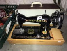 A Gold Leaf sewing machine (cover does not match it is just used to protect the machine)(Collect