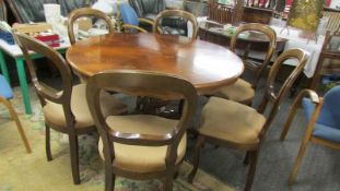 A mahogany inlaid extending dining table with six mahogany dining chairs. (Collect only).