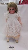 A Victorian porcelain doll, Made in Germany, 390, L 210 M.