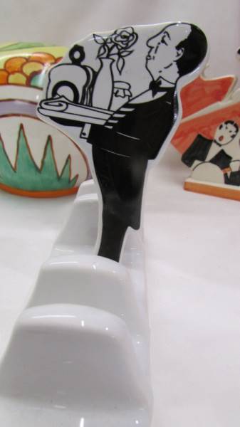 An abstract design tea set, two 1920's style figures and a Butler toast rack. - Image 5 of 5