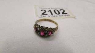 A 9ct gold seed pearl and garnet set ring, size N.