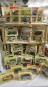 Approximately sixty boxed die cast trade vehicles.